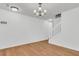 Spacious living room with hardwood floors, light walls, and staircase access to the upper level at 250 Xavier St, Charleston, SC 29414