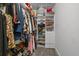 Walk-in closet features custom shelving and ample space for storing clothes, shoes and handbags at 2595 Bohicket Rd, Johns Island, SC 29455