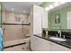 Stylish bathroom featuring a glass-enclosed shower, granite countertops, and modern fixtures at 2653 Seabrook Island Rd, Seabrook Island, SC 29455