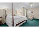 Inviting bedroom with a four-poster bed, sitting area, and comfortable decor at 2653 Seabrook Island Rd, Seabrook Island, SC 29455