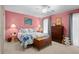 Comfortable bedroom featuring a quilt bedspread, wood chest, plush carpeting and charming decor at 2653 Seabrook Island Rd, Seabrook Island, SC 29455