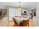 Dining room features an ornate chandelier, a wooden table with seating and a view of the kitchen at 2653 Seabrook Island Rd, Seabrook Island, SC 29455
