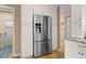 Stainless steel refrigerator surrounded by white cabinets, a complement to the kitchen at 2653 Seabrook Island Rd, Seabrook Island, SC 29455