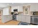 Bright kitchen features white cabinets, stainless steel appliances, and granite countertops at 2653 Seabrook Island Rd, Seabrook Island, SC 29455