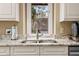 Granite counter with stainless faucet and sink in front of a window with a view at 2653 Seabrook Island Rd, Seabrook Island, SC 29455