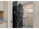 Modern black stackable washer and dryer in the laundry room at 2653 Seabrook Island Rd, Seabrook Island, SC 29455
