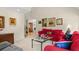 Comfortable living room with plush red seating, decorative pillows, and artwork adding warmth to the space at 2653 Seabrook Island Rd, Seabrook Island, SC 29455