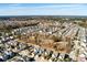 A high aerial view of a residential neighborhood surrounded by trees and waterways under a clear sky at 2751 Rutherford Way, Charleston, SC 29414