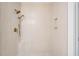 Elegant walk-in shower with stylish fixtures and vertical tiling and small soap and shampoo niches at 2924 Lodge Berry Ln, Johns Island, SC 29455