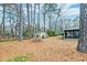 View of backyard featuring trees and the screened in back porch at 306 Runnymede Ln, Summerville, SC 29485