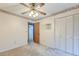 Bedroom featuring a ceiling fan, closet with folding doors, and carpet flooring at 306 Runnymede Ln, Summerville, SC 29485