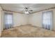 Spacious bedroom featuring a ceiling fan, neutral walls, and carpet flooring at 306 Runnymede Ln, Summerville, SC 29485