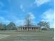 Community clubhouse with covered porch and manicured landscaping at 306 Runnymede Ln, Summerville, SC 29485