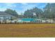 Community pool enclosed by fence and adjacent to lawn at 306 Runnymede Ln, Summerville, SC 29485