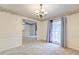 Dining room with chair rail, wallpaper, chandelier and an open floorplan at 306 Runnymede Ln, Summerville, SC 29485