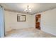 Bright dining room featuring classic wainscoting and trim and a decorative light fixture at 306 Runnymede Ln, Summerville, SC 29485