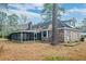Charming brick home featuring screened-in porch and well-maintained yard at 306 Runnymede Ln, Summerville, SC 29485