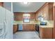 Cozy kitchen featuring wood cabinets, stainless appliances and plenty of natural light at 306 Runnymede Ln, Summerville, SC 29485