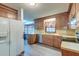 Well-lit kitchen featuring wood cabinets, stainless appliances and a refrigerator at 306 Runnymede Ln, Summerville, SC 29485