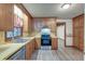 Kitchen featuring wood cabinets, stainless steel appliances, and wood-style flooring at 306 Runnymede Ln, Summerville, SC 29485