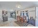 Sunlit dining area with modern rug, decorative lighting, and easy access to a modern kitchen at 307 Glen St, Summerville, SC 29483