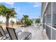 Well-maintained backyard with patio, palm trees, outdoor furniture, and a view of the home at 3115 Cross Vine Ln, Summerville, SC 29483