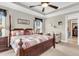 Beautiful bedroom featuring a four poster bed, ceiling fan, and serene neutral tones at 3115 Cross Vine Ln, Summerville, SC 29483