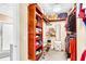 Well-organized walk-in closet with custom shelving and ample storage for clothes and accessories at 3115 Cross Vine Ln, Summerville, SC 29483