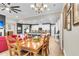 Open-concept dining area and kitchen with stainless steel appliances, stone counter tops, and a large dining table at 3115 Cross Vine Ln, Summerville, SC 29483