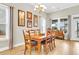 Formal dining area with wooden table and chairs, natural light, and decor at 3115 Cross Vine Ln, Summerville, SC 29483