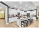 Bright kitchen features a large island with seating, granite counters, and stainless steel appliances, perfect for entertaining at 3115 Cross Vine Ln, Summerville, SC 29483
