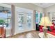 Bright living room featuring sliding doors that lead to an outdoor screened patio or balcony at 3115 Cross Vine Ln, Summerville, SC 29483