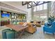 Bright community lounge featuring comfortable seating, a bar area, and a large-screen TV at 3115 Cross Vine Ln, Summerville, SC 29483