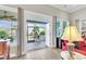 Bright living room featuring sliding doors that lead to an outdoor screened patio or balcony at 3115 Cross Vine Ln, Summerville, SC 29483