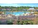 Resort-style pool with lounge chairs, umbrellas, and seating areas surrounded by lush landscaping at 3115 Cross Vine Ln, Summerville, SC 29483