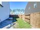 A well-maintained backyard with a wooden fence and some grass at 315 Silent Bluff Dr, Summerville, SC 29486