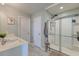 Modern bathroom featuring a glass-enclosed shower, double sinks, and sleek tile flooring at 315 Silent Bluff Dr, Summerville, SC 29486
