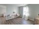 Serene bedroom featuring soft chairs, decor table and a sunlit window with sheer curtains at 315 Silent Bluff Dr, Summerville, SC 29486
