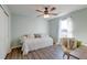 Cozy bedroom with a ceiling fan, daybed and a sunlit window with light-filtering curtains at 315 Silent Bluff Dr, Summerville, SC 29486