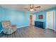 Spacious bedroom with a soft armchair, dresser, a ceiling fan, and wood-look floors at 315 Silent Bluff Dr, Summerville, SC 29486