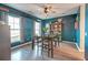 Stylish dining room with wood floors, chic light fixture, and modern decor for memorable meals at 315 Silent Bluff Dr, Summerville, SC 29486