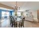 Open-concept dining room with stylish chandelier and views to the living room and blue accent wall at 315 Silent Bluff Dr, Summerville, SC 29486