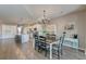 Open concept dining area and kitchen features hardwood floors and decorative chandelier lighting at 315 Silent Bluff Dr, Summerville, SC 29486