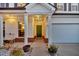 Inviting front porch with well-maintained landscaping leading to the front door and an attached garage at 315 Silent Bluff Dr, Summerville, SC 29486