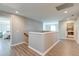 Upstairs hallway with views of the bedroom and laundry, featuring wood-look flooring at 315 Silent Bluff Dr, Summerville, SC 29486