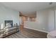 Hallway with wood-look flooring, and view of kitchen area beyond the half wall at 315 Silent Bluff Dr, Summerville, SC 29486