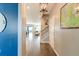 Bright hallway with hardwood floors, stairway, and a view into the living spaces at 315 Silent Bluff Dr, Summerville, SC 29486