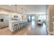 Open layout showing kitchen, dining, and living spaces with hardwood floors throughout the home at 315 Silent Bluff Dr, Summerville, SC 29486