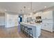 Modern kitchen with stainless steel appliances, granite countertops, and a large island with barstool seating at 315 Silent Bluff Dr, Summerville, SC 29486