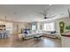 Open-concept living room with a large sectional sofa, hardwood floors, and seamless access to the kitchen at 315 Silent Bluff Dr, Summerville, SC 29486